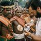 Photographer Frank Schreider shows men from Timor island his camera in a 1962 issue of National Geographic. The magazine often ran photos of “uncivilized” native people seemingly fascinated by “civilized” Westerners’ technology. (Credit: Frank and Helen Schreider, National Geographic Creative)